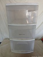 Front view of tower showing three translucent drawers