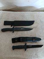 Both knives and sheaths laid out for overview