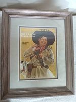Full view of framed signed magazine cover