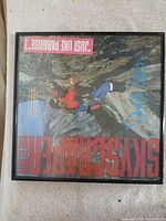 Full view of framed Skyscraper album front