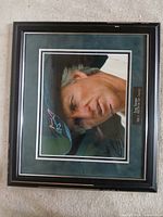 Full view of framed autographed Greg Norman photo