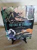 Front cover showing title, artwork, green cord binding
