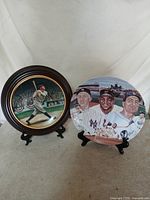Overall view of both commemorative plates on display stands