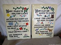 Both plaques front view showing prayers and painted motifs