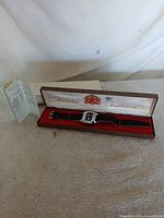 Watch in open presentation box with outer box and leaflet visible