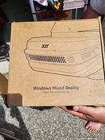 Brown cardboard retail box showing Acer Windows Mixed Reality illustration