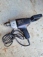 Overall view of Black & Decker corded drill with attached power cord
