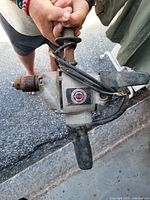 Overall view of Black & Decker corded drill with keyed chuck, auxiliary handle, worn cord