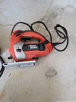 Overall view of Black & Decker corded jigsaw showing housing, cord and base