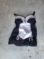 Front view of black and pink satin mesh lace-trim chemise babydoll laid flat