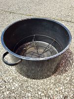 Overall view of black stock pot interior with rack