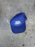 Top view of blue Bud Light baseball cap showing logo and wear