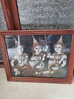 Framed hand-painted Thai fabric artwork showing three mythological figures