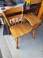 Full view of light oak telephone bench showing seat, turned legs, spindle backrest, attached side shelf and overall condition