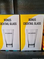 Front view of two sealed McGuinness Bonus Cocktail Glass boxes