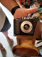 Front view of Modell P 56 camera in open leather case