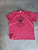 Front view of red XL T-shirt showing Iron Warfare graphic and overall condition