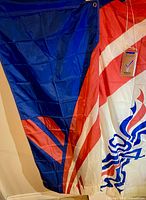 Full view of banner showing red white blue design and attached tag