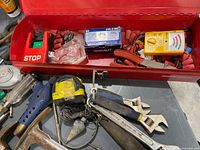 Open Mastercraft toolbox showing electrical tester, connectors, tape measure, small switch box