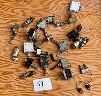 All components spread out on wooden surface showing quantity and variety