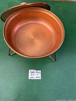 open chafing pan on stand showing interior