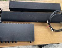 Lot overview showing two Samsung soundbars, Harman VC-3 controller and cables
