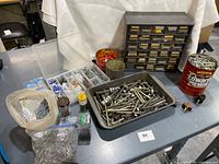 overview of fasteners, organizers and containers on table