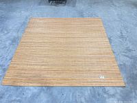 Full view of square bamboo rug laid flat on floor