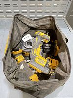 Top view into bag showing DeWalt XR impact driver, charger, battery and bag interior