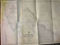 Both charts side by side showing titles and Admiralty seals
