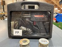 Front view of Weller carry case showing gun, cord and solder spools