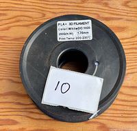 Top view of filament spool showing label with PLA+ 250 g, diameter 1.75 mm, print temp 200-230 °C