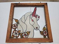 Full view of framed painted glass unicorn suncatcher