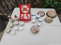 Overall view showing boxed set, sake bottles, cups and plates