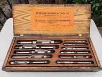 Case open showing all eleven reamers and interior label