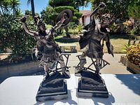 Front view of both bronze-finish Roman warrior figurines on wood bases