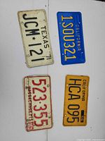 Group shot of all four license plates laid out