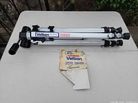 Tripod folded with cardboard insert on table