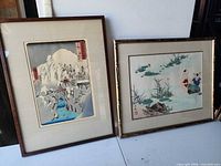 Both framed prints side by side
