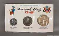 Front of sealed Bicentennial Coinage set showing three coins and printed card