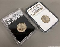 Front view of both graded coins in slabs