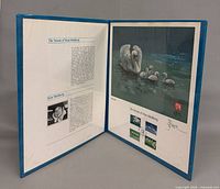 Open folio showing both pages of limited edition set