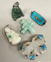 All five jewelry pieces arranged on neutral background