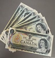 Six 1973 Canadian $1 bills fanned