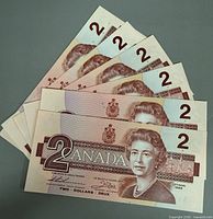 Six $2 Canada banknotes obverse side with Queen Elizabeth II