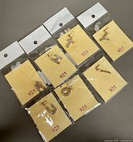 All seven letter pendants in individual pouches