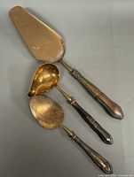Overall view of three serving utensils