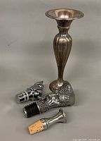 Group shot showing vase and four stoppers