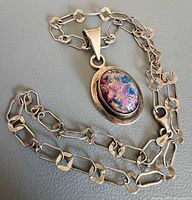 Full view of sterling chain and opal pendant