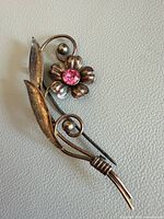 Full view of flower brooch showing overall design and condition